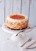 An apricot cream cake decorated with flaked almonds