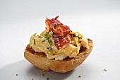Scrambled egg with bacon on a toasted roll