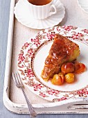 A slice of Bundt cake with plum compote