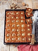 Gingerbread cake with walnuts on a baking tray