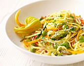 Egg pasta with summer vegetables and courgette flowers