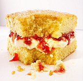 A slice of Victoria Sponge Cake with a bite take out