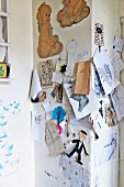 Drawings and photos pinned to wall