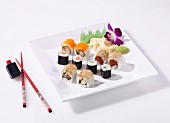 A sushi platter of maki and California rolls