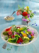 An edible flower salad with strawberries