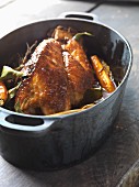 Roast guinea fowl in a roasting dish