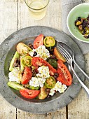 Tomato and olive salad with goat's cheese
