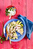 Tostada with smoked chicken breast, red onions and grated cheese (Mexico)