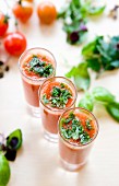 Cold tomato soup with basil in shot glasses