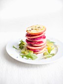 A stack of apple and pickled beetroot slices