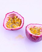 A red passion fruit, halved