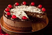 Black Forest Gateau with glace cherries, sliced