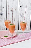 Three rhubarb drinks with straws