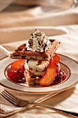 Ice cream dessert with waffles and peaches