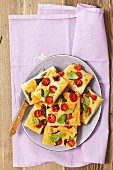 Focaccia with cherry tomatoes, goat's cheese and basil