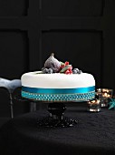 An elegant Christmas cake decorated with sugared fruits