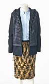 A light blue blouse and a brown sequinned skirt with an open quilted anorak