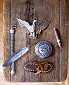 Various objects on rustic, weathered wooden board