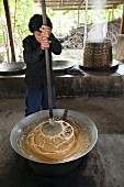 Coconut sugar being made, Thailand