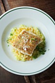 Cod with a roast onion crust on a bed of potato risotto