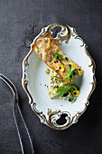 An olive tartlet with marinated goat's cheese