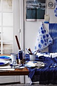 Indigo dye, dying utensils, dyed fabric and papers
