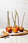 Toffee apples on a piece of baking paper
