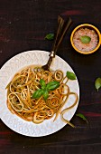 Tricoloured spaghetti with butter and basil