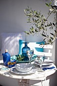 Table set with blue and white crockery on terrace