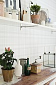 White, shabby-chic dresser and kitchen shelf on grey and white checked wall