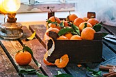 A wooden crate of clementines