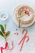 A place setting and candy canes