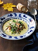 Autumnal chanterelle mushroom soup with herbs and Parmesan cheese