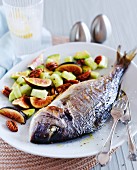 Crispy baked sea bream with cucumbers, figs and pecan nuts
