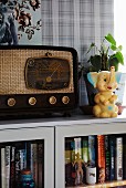 Retro radio and toy elephant on top of cabinet