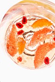 A cocktail with fruits (seen from above)