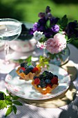 Mini lemon tartlets with mixed summer berries