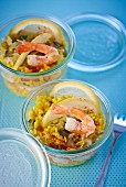 Risotto with prawns and lemons in glasses