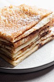 A stack of sugared pancakes