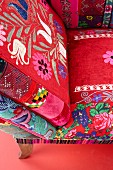 Chair with ethnic patterns on red upholstery