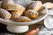 Chocolate chip madeleines dusted with icing sugar