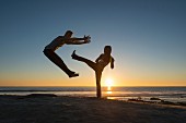 People practising sport on the beach at La Jolla, California