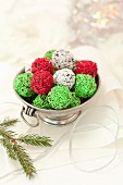 Christmas truffles with white, green and red sugar sprinkles