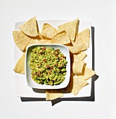 Bowl of Homemade Guacamole; Tortilla Chips