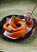 Baked pumpkin wedges with honey