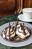 Somlói Galuska (dessert of sponge cake, rum and raisins, chocolate sauce and cream) in Café Gerbeaud, Budapest, Hungary