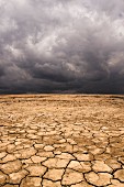 A dramatic stormy sky over an arid landscape