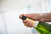 A bottle of champagne being opened