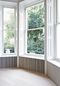 Traditional room with bay window overlooking garden