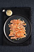 Salmon carpaccio with a dill and mustard dressing
